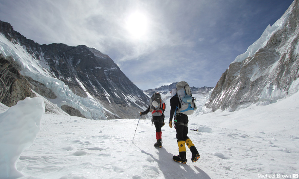 climbing to top of mountain